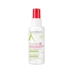 A-derma Cutalgan sprej 100 ml na ziidću kraj trave
